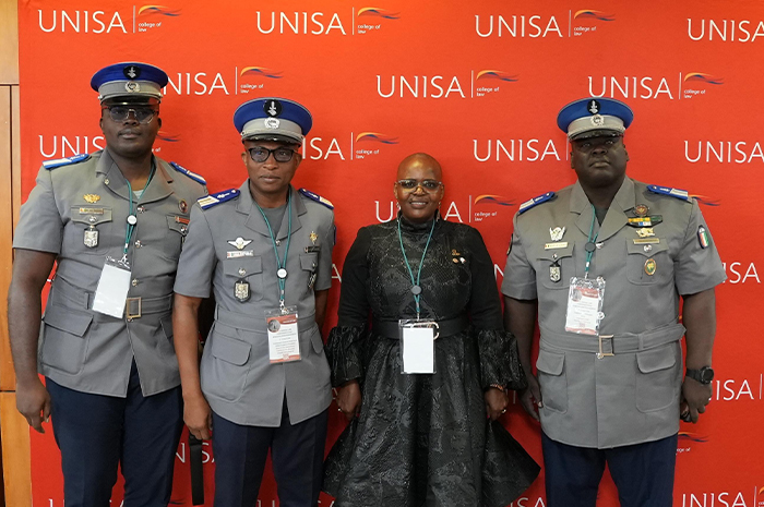 The-Ivorian-delegation-with-the-Execetive-Dean-of-the-College-of-Law-banner.JPG